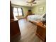 Bedroom with hardwood floors, dresser, and natural light at 321 Roses Creek Dr, Lawrenceville, GA 30044