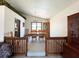 Sunlit dining room with chandelier, carpet, and elegant wooden furniture at 321 Roses Creek Dr, Lawrenceville, GA 30044