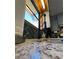 Close up of a kitchen sink with granite countertops, green tile backsplash, and stainless steel faucet at 321 Roses Creek Dr, Lawrenceville, GA 30044