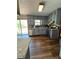 Open kitchen with gray cabinets, granite countertops, stainless steel appliances, and access to the deck at 321 Roses Creek Dr, Lawrenceville, GA 30044