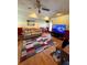 Cozy living room with stylish furniture, a large TV, and hardwood floors, creating a comfortable atmosphere at 321 Roses Creek Dr, Lawrenceville, GA 30044