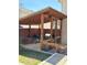 Outdoor patio featuring a wood pergola for shade and privacy with a fence and concrete base at 321 Roses Creek Dr, Lawrenceville, GA 30044