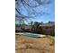 Backyard featuring a refreshing in-ground pool and deck, great for enjoying warm days and outdoor living at 321 Roses Creek Dr, Lawrenceville, GA 30044