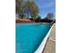Inviting in-ground pool with crystal-clear water and a surrounding deck, perfect for relaxation and summer fun at 321 Roses Creek Dr, Lawrenceville, GA 30044