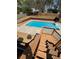 Backyard in-ground swimming pool surrounded by wooden fences and greenery at 321 Roses Creek Dr, Lawrenceville, GA 30044
