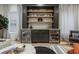 Stylish bar area featuring custom cabinets, wine coolers, and decorative shelving at 1168 Mado Loop, Chattahoochee Hills, GA 30268