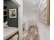 Hallway with decorative art and built-in reading nook with storage underneath at 1168 Mado Loop, Chattahoochee Hills, GA 30268
