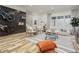Spacious living room featuring modern decor, large windows, and a mounted bicycle display at 1168 Mado Loop, Chattahoochee Hills, GA 30268