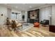 Bright living room featuring hardwood floors, stylish furniture, and a built-in bar at 1168 Mado Loop, Chattahoochee Hills, GA 30268