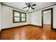 Bright bedroom with neutral walls and hardwood floors at 1420 Elizabeth Ln, East Point, GA 30344
