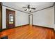 Bright bedroom features hardwood floors, a ceiling fan, and neutral walls at 1420 Elizabeth Ln, East Point, GA 30344