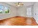 Sun-lit bedroom features hardwood floors and neutral walls at 1420 Elizabeth Ln, East Point, GA 30344