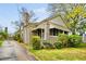Charming home exterior with brick facade, awnings, and well-manicured landscaping at 1420 Elizabeth Ln, East Point, GA 30344
