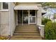 Inviting front porch with steps, offering a cozy entrance to the home at 1420 Elizabeth Ln, East Point, GA 30344