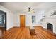Bright living room with hardwood floors, fireplace, and natural light at 1420 Elizabeth Ln, East Point, GA 30344