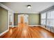 Open-concept living space with hardwood flooring and classic archway design at 1420 Elizabeth Ln, East Point, GA 30344