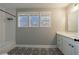 Bathroom features subway tile in the shower, decorative floor tile, and bright natural light at 2620 Oak St, Atlanta, GA 30344