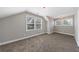 Bedroom features neutral walls, plush carpet, and abundant light from multiple large windows at 2620 Oak St, Atlanta, GA 30344