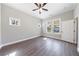 Bedroom features hardwood floors, a ceiling fan, neutral walls, and natural light at 2620 Oak St, Atlanta, GA 30344