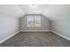 Bedroom featuring plush carpeting, neutral paint, vaulted ceilings, and ample natural light at 2620 Oak St, Atlanta, GA 30344