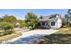 Beautiful home on a tree-lined street featuring a large driveway and manicured lawn at 2620 Oak St, Atlanta, GA 30344