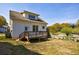The house boasts a charming exterior featuring a wooden deck, access door, and well-maintained lawn at 2620 Oak St, Atlanta, GA 30344