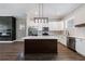 Beautiful kitchen with white cabinets, stainless appliances, a large island, and wood floors, perfect for cooking and entertaining at 2620 Oak St, Atlanta, GA 30344