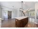 Open-concept living room with hardwood floors, statement lighting, and stylish sliding barn door at 2620 Oak St, Atlanta, GA 30344