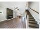 Open-concept living room featuring hardwood floors, a fireplace, and access to the kitchen at 2620 Oak St, Atlanta, GA 30344