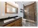 Main bathroom features a double sink vanity, new tile, and walk-in shower at 2620 Oak St, Atlanta, GA 30344