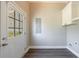 Mud room with access to backyard, utility closet and white cabinetry at 2620 Oak St, Atlanta, GA 30344