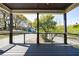 Enjoy the view from this spacious porch with a ceiling fan and railing, perfect for relaxation and entertainment at 2620 Oak St, Atlanta, GA 30344