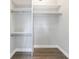 Walk-in closet with hardwood floors, multiple racks, and overhead shelving at 2620 Oak St, Atlanta, GA 30344