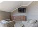 Inviting outdoor sitting area with two chairs, table, TV, and storage cabinet at 312 Concord St, Alpharetta, GA 30009