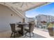 Outdoor covered patio with a table and chairs, with community view at 312 Concord St, Alpharetta, GA 30009