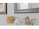 Bathroom counter with modern faucet, candle, and stacked towels at 312 Concord St, Alpharetta, GA 30009