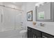 Updated bathroom with glass shower door, vanity, framed mirror, and modern fixtures at 312 Concord St, Alpharetta, GA 30009