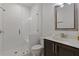 Clean bathroom with white tiled shower and dark wood vanity at 312 Concord St, Alpharetta, GA 30009