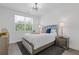 This bedroom features a large window for natural light and a mirrored nightstand at 312 Concord St, Alpharetta, GA 30009