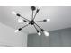 A close-up of the modern chandelier with exposed bulbs in the bedroom at 312 Concord St, Alpharetta, GA 30009