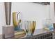 Close-up of decorative glass vases and books on a shelf, adding an artistic touch to the space at 312 Concord St, Alpharetta, GA 30009