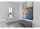 Entryway featuring modern art, tiled floors, a bench, and a bright front door at 312 Concord St, Alpharetta, GA 30009