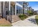 Inviting townhouse featuring a brick facade, manicured lawn, and cozy entrance at 312 Concord St, Alpharetta, GA 30009