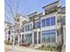 Beautiful townhome showcasing a brick facade, balcony, and manicured landscaping at 312 Concord St, Alpharetta, GA 30009