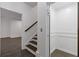 Hallway features hardwood floors, stairs with a wooden railing and an elevator at 312 Concord St, Alpharetta, GA 30009