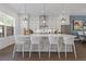 Bright, white kitchen with modern appliances, stylish bar stools, and pendant lighting at 312 Concord St, Alpharetta, GA 30009