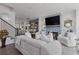 Inviting living room with fireplace, TV, stylish decor, and open floor plan at 312 Concord St, Alpharetta, GA 30009