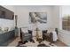 Comfortable seating area with leather chairs, art, a rug, and a stylish table at 312 Concord St, Alpharetta, GA 30009