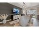 Well-appointed living room with modern furnishings, a gray accent wall, and a view of the balcony at 312 Concord St, Alpharetta, GA 30009