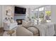 Cozy living room featuring a fireplace, large windows, and comfortable seating at 312 Concord St, Alpharetta, GA 30009
